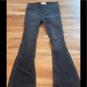 Free People black naturally faded stretch flare leg jeans.